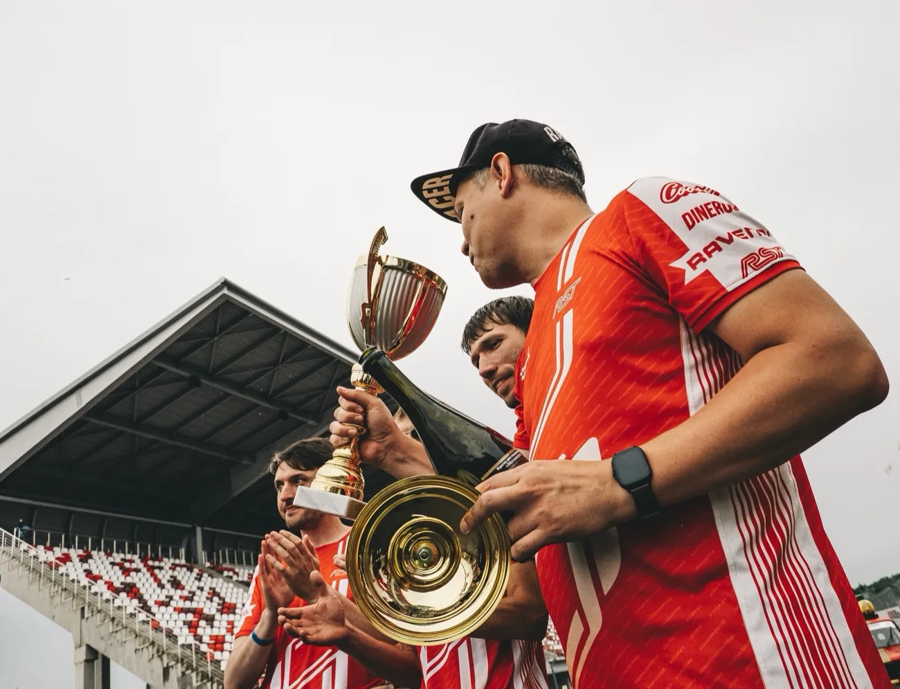 On the podium with the trophy